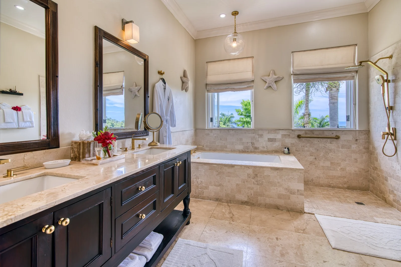 Marble en-suite bathroom with a sunken tub